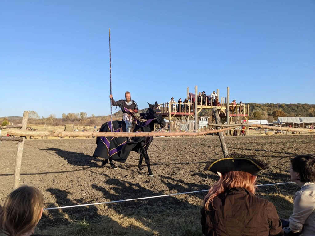 Jouster on a black horse at Bluffwoods Renaissance Festival