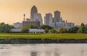 Des Moines, Iowa city skyline with green grass in the foreground